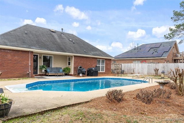 view of swimming pool featuring outdoor lounge area, grilling area, and a patio area