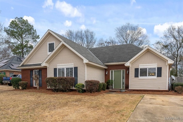 single story home featuring a front lawn