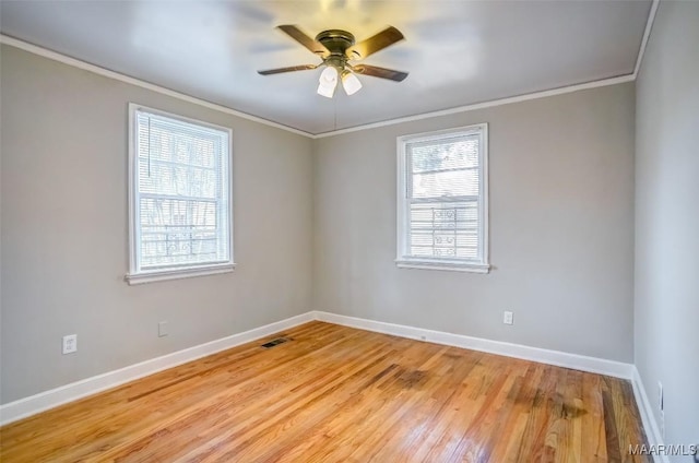 empty room with crown molding, ceiling fan, and light hardwood / wood-style floors