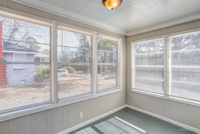 unfurnished sunroom with plenty of natural light