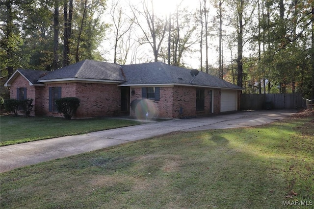 single story home featuring a garage and a front yard