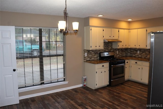 kitchen with decorative light fixtures, dark wood-type flooring, decorative backsplash, and appliances with stainless steel finishes