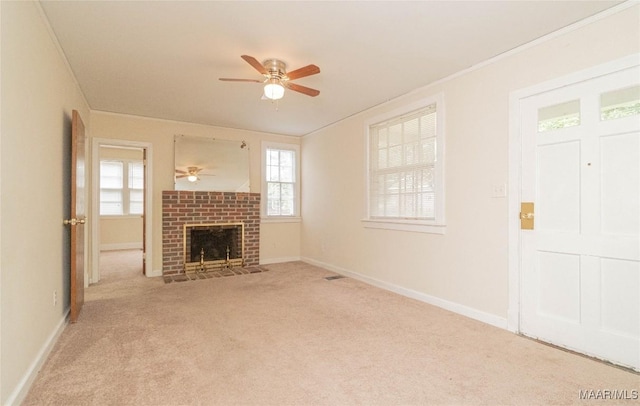 unfurnished living room featuring ceiling fan, light colored carpet, and a fireplace