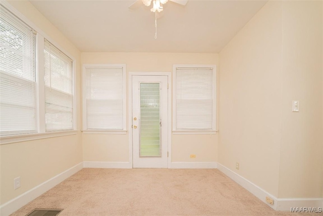 unfurnished room with light carpet