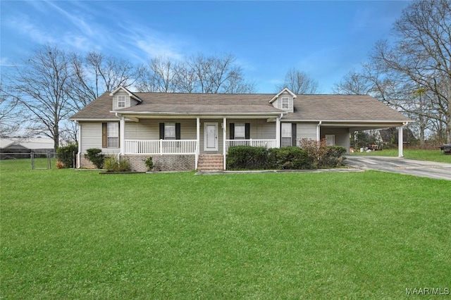 ranch-style home featuring a carport, a porch, and a front lawn