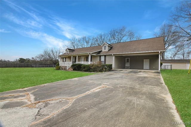 single story home with a porch, a carport, and a front lawn