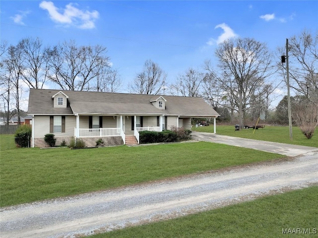 ranch-style house with a carport, covered porch, and a front yard