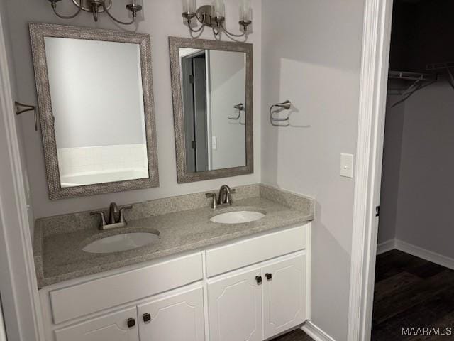 bathroom with vanity and hardwood / wood-style floors