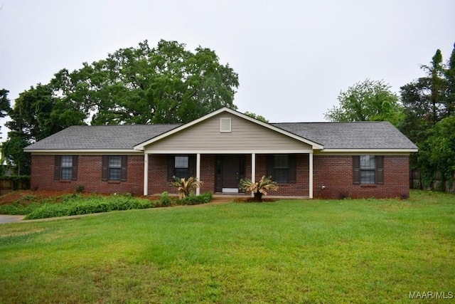 6515 Redland Rd, Wetumpka, AL 36093 - single story home with a porch, brick siding, and a front yard
