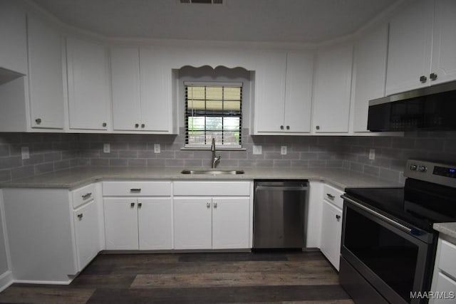 6515 Redland Rd, Wetumpka, AL 36093 - kitchen with appliances with stainless steel finishes, dark wood-style flooring, tasteful backsplash, and a sink