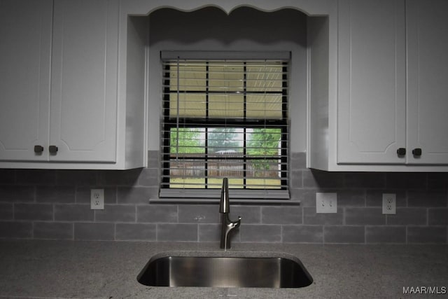 6515 Redland Rd, Wetumpka, AL 36093 - kitchen with a sink, white cabinetry, light stone counters, and backsplash