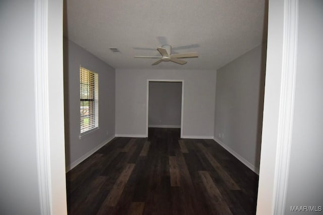 6515 Redland Rd, Wetumpka, AL 36093 - spare room with a ceiling fan, baseboards, dark wood finished floors, and visible vents