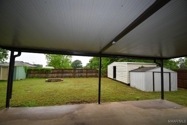 6515 Redland Rd, Wetumpka, AL 36093 - view of yard featuring a fenced backyard, a storage shed, a patio area, and an outbuilding