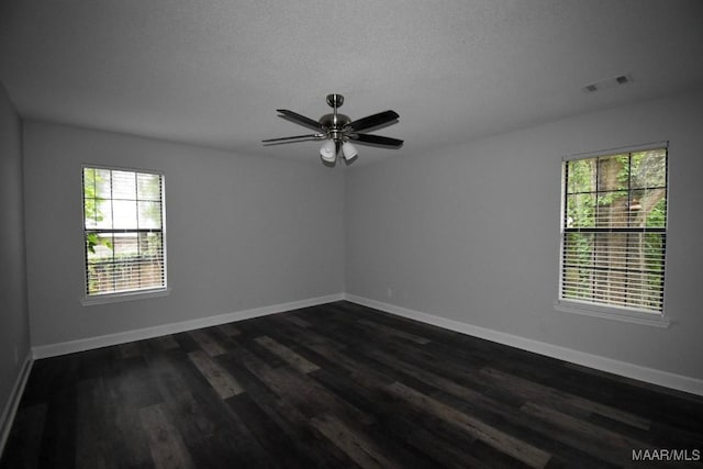 6515 Redland Rd, Wetumpka, AL 36093 - spare room featuring a wealth of natural light, visible vents, baseboards, and dark wood-style floors