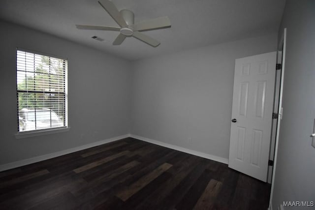 6515 Redland Rd, Wetumpka, AL 36093 - unfurnished room with baseboards, dark wood-style flooring, and a ceiling fan
