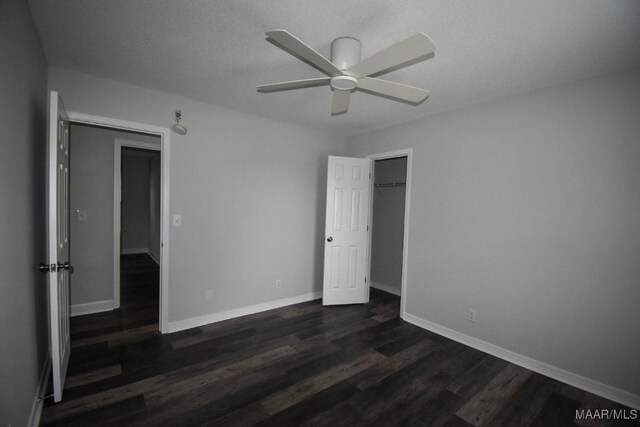 6515 Redland Rd, Wetumpka, AL 36093 - unfurnished bedroom with baseboards, a ceiling fan, and dark wood finished floors