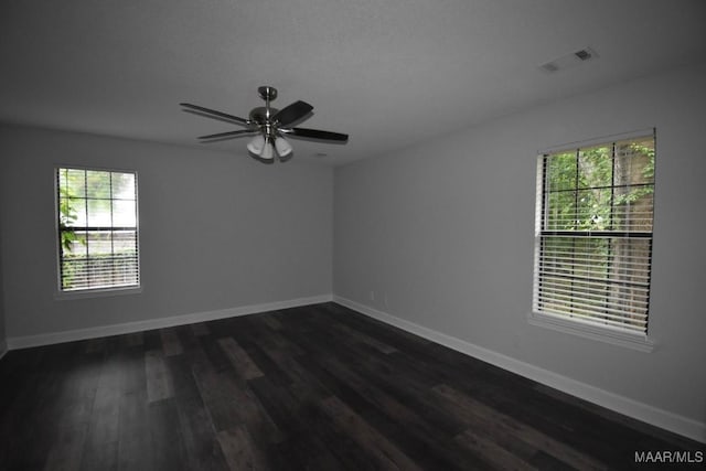6515 Redland Rd, Wetumpka, AL 36093 - empty room with baseboards, dark wood finished floors, visible vents, and a ceiling fan