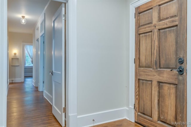 hall with hardwood / wood-style floors