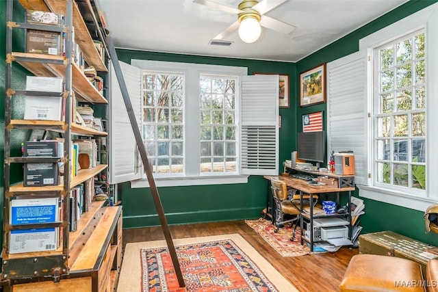 home office with hardwood / wood-style flooring, a wealth of natural light, and ceiling fan