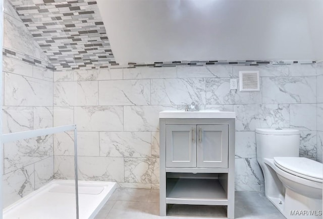 bathroom with walk in shower, lofted ceiling, toilet, tile walls, and vanity