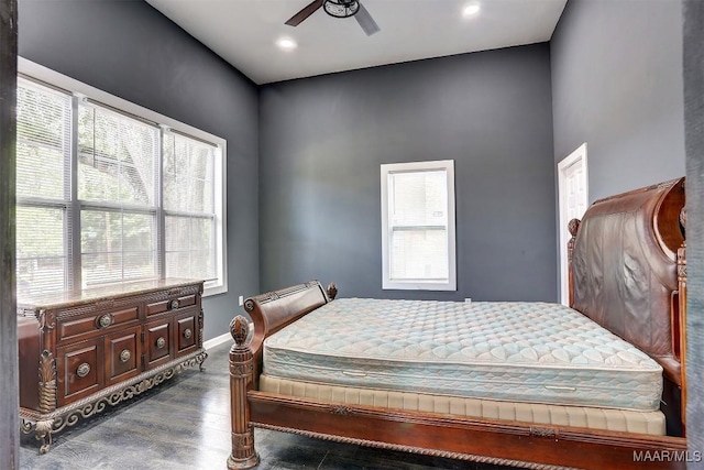 bedroom featuring dark wood-type flooring and ceiling fan