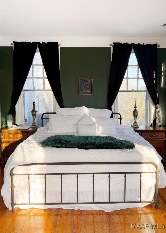 bedroom featuring wood-type flooring