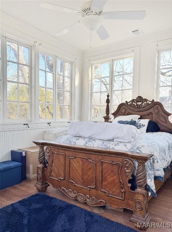 bedroom featuring ceiling fan and wood-type flooring