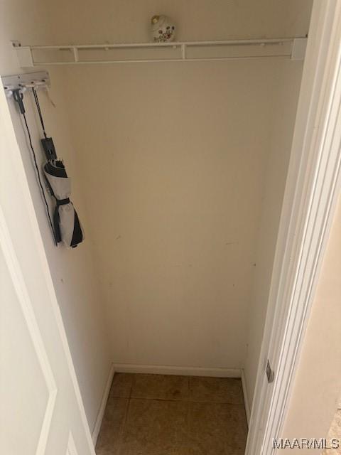 spacious closet featuring tile patterned floors