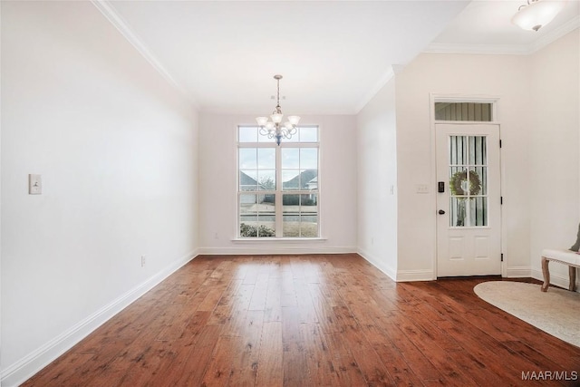 interior space with crown molding, dark wood-type flooring, and a notable chandelier