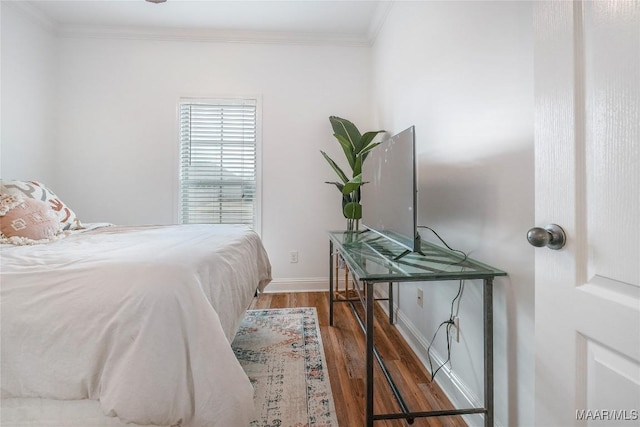 bedroom with ornamental molding and dark wood-type flooring