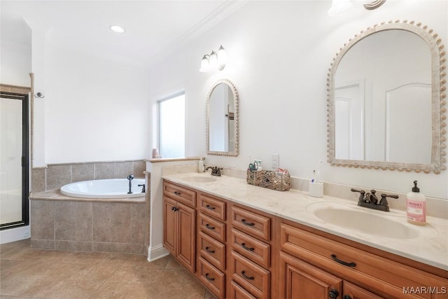 bathroom with tile patterned flooring, vanity, crown molding, and shower with separate bathtub