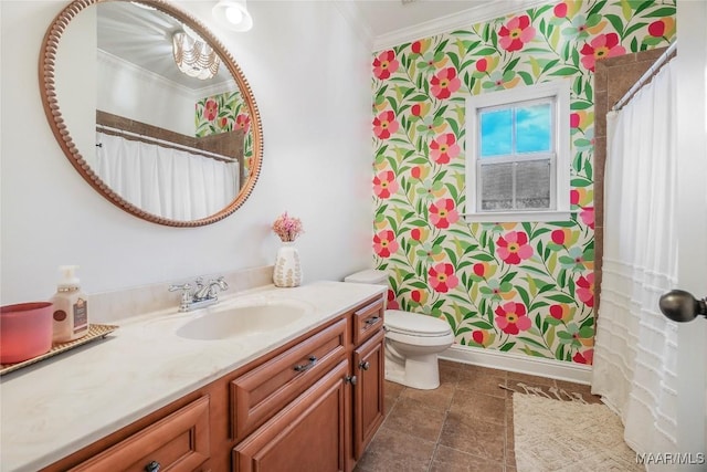 bathroom featuring crown molding, vanity, and toilet