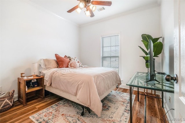 bedroom featuring ornamental molding and wood-type flooring