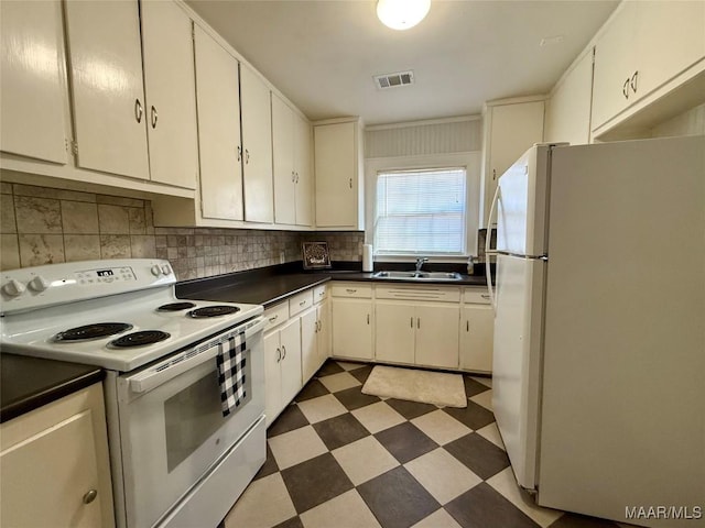 kitchen featuring sink, white cabinets, white appliances, and decorative backsplash