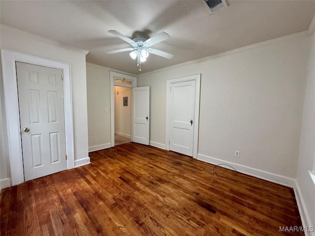 unfurnished bedroom with wood-type flooring, ceiling fan, and crown molding