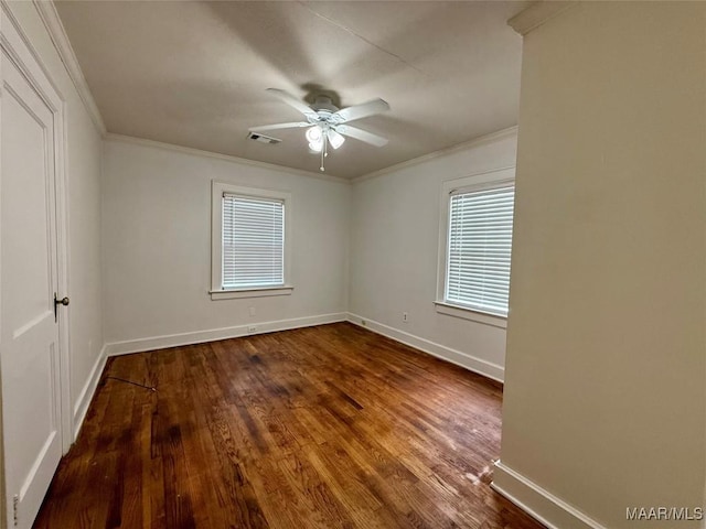 spare room with ornamental molding, ceiling fan, and dark hardwood / wood-style flooring