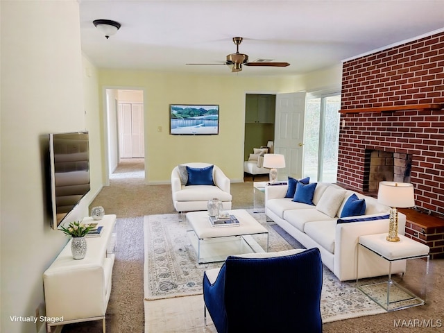 living room with a brick fireplace and ceiling fan