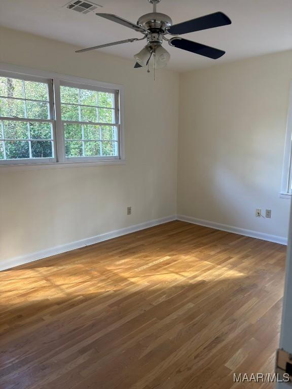 spare room featuring hardwood / wood-style flooring