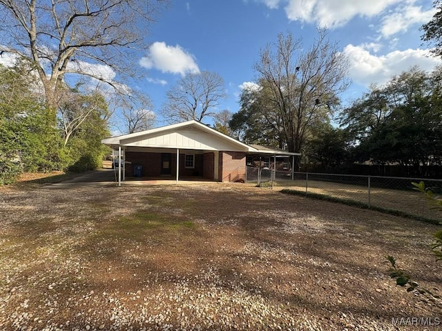 exterior space with a carport