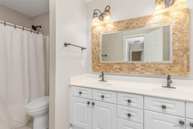 bathroom with a shower with curtain, vanity, and toilet