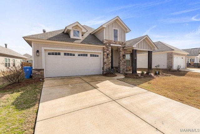 craftsman house with a garage and a front yard