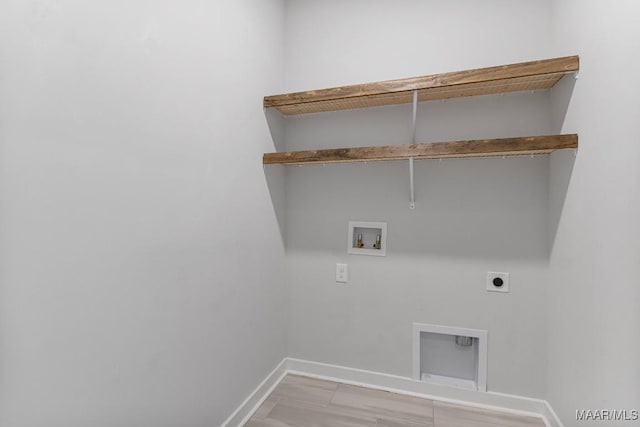 laundry area with hookup for a washing machine and hookup for an electric dryer