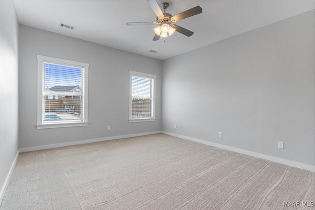 carpeted empty room with ceiling fan