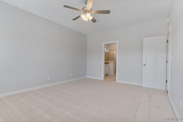 unfurnished bedroom with light carpet, ceiling fan, and ensuite bath