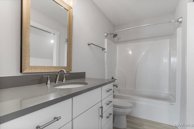 full bathroom with vanity, shower / bathing tub combination, and toilet