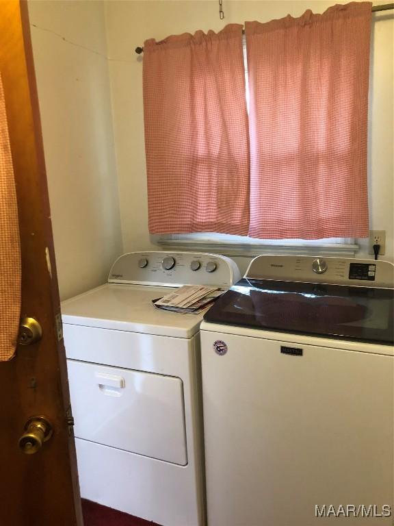 laundry area with separate washer and dryer