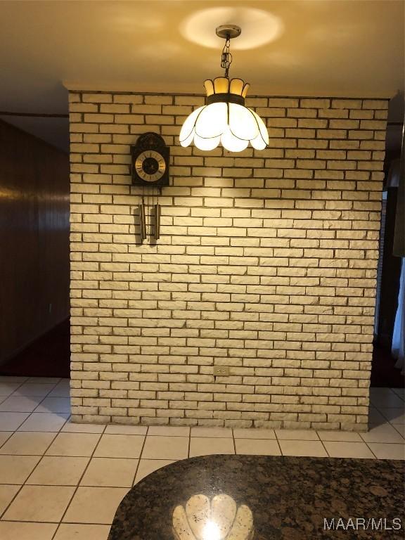 unfurnished dining area featuring light tile patterned floors