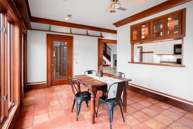 dining space with light tile patterned flooring