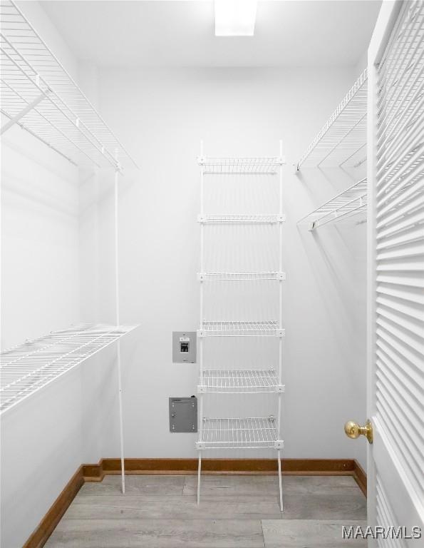 walk in closet featuring hardwood / wood-style floors