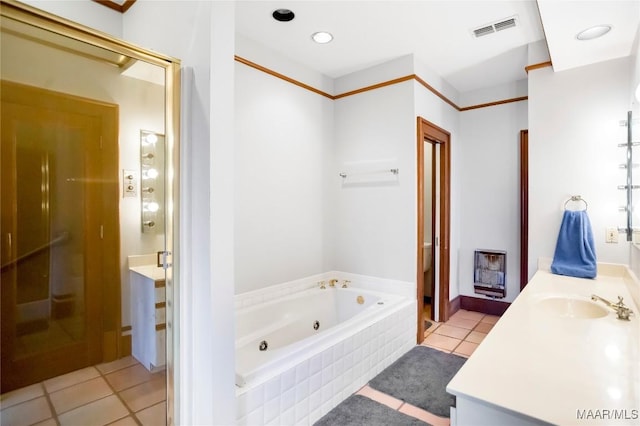 bathroom with vanity, shower with separate bathtub, heating unit, and tile patterned floors